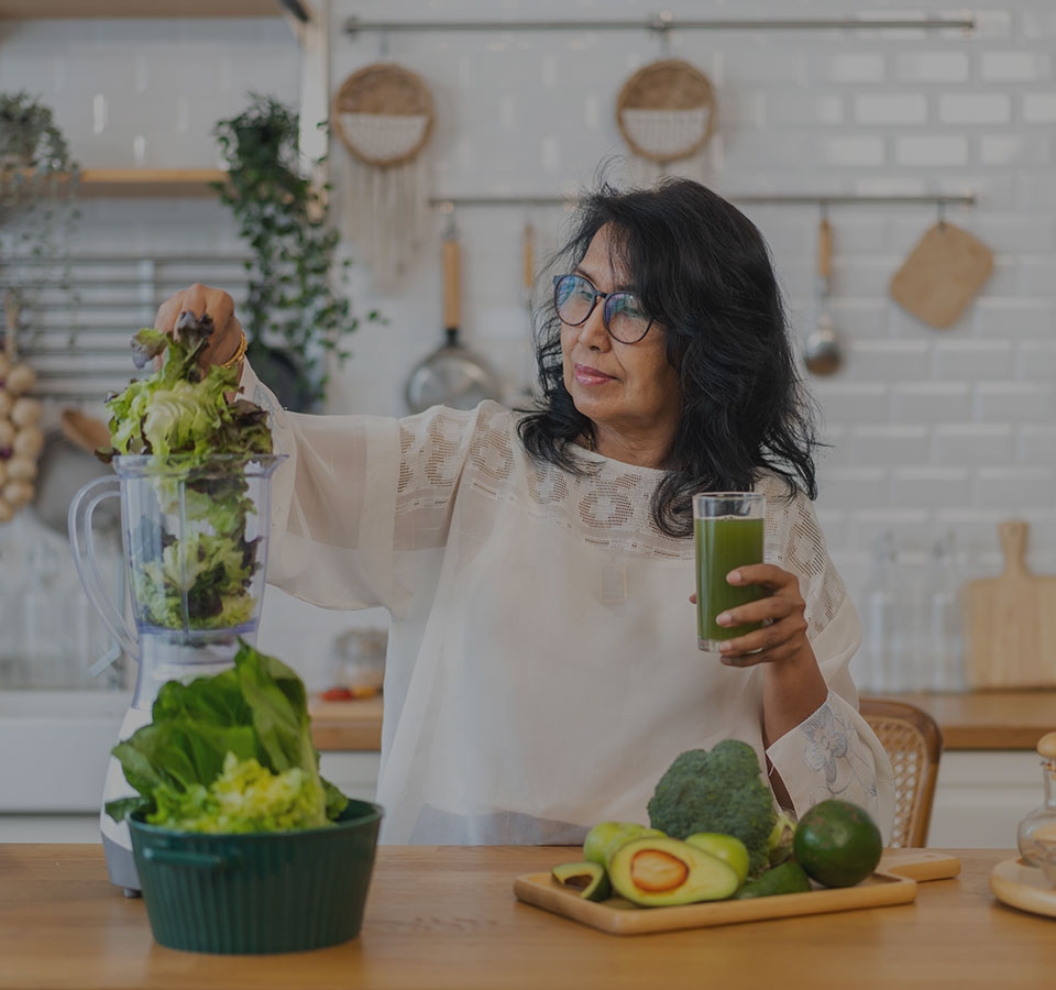 image of woman juicing in her kitchen